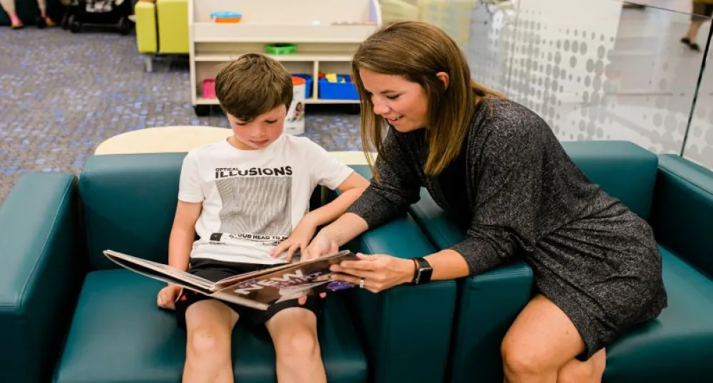 Adult reading books to a child