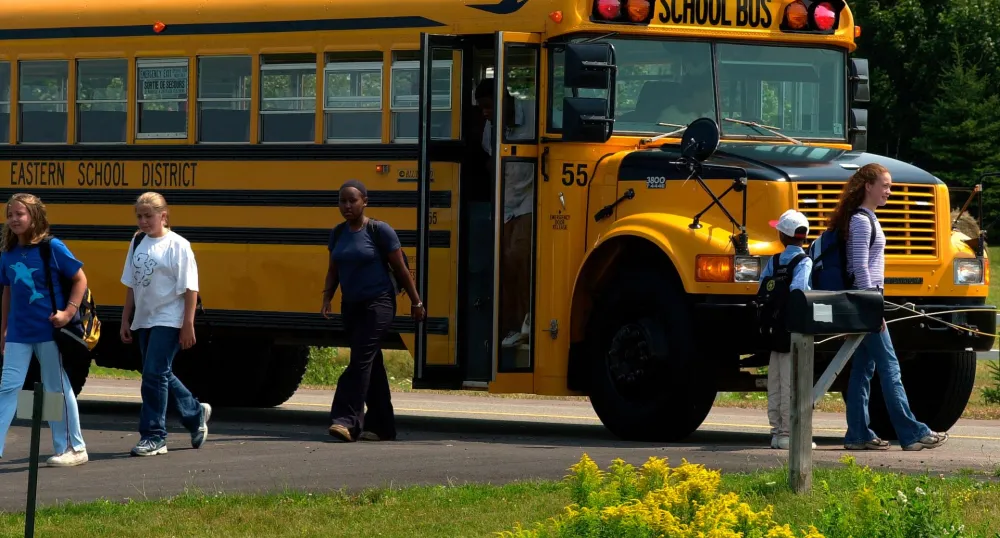 Children getting off a school bus