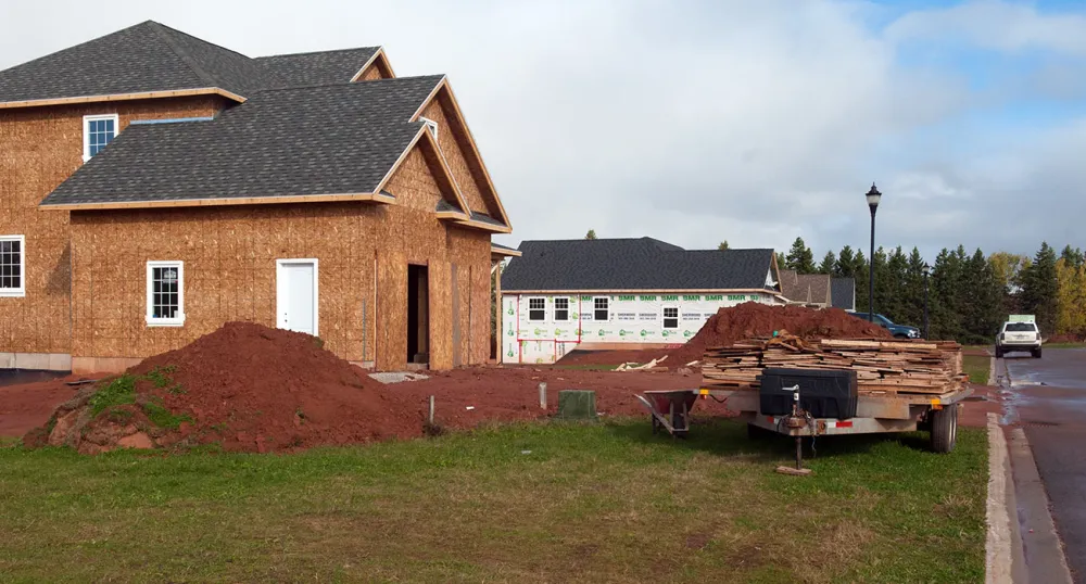 A construction site with a house being built. 