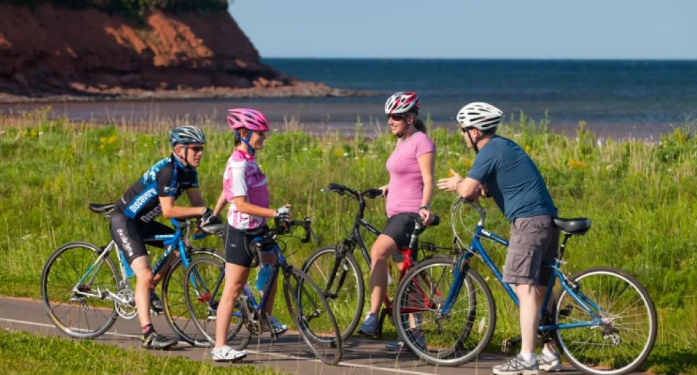Group of four biking on cycling lane in PEI National Park
