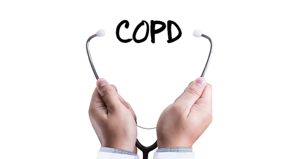 Stethoscope wrapped around the letters COPD (Chronic Obstructive Pulmonary Disease)