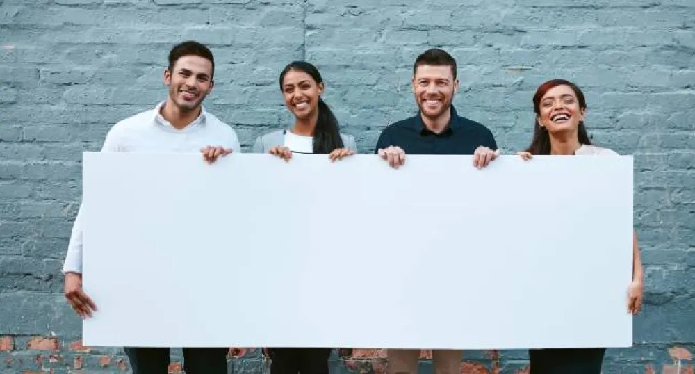 people holding a blank  sign
