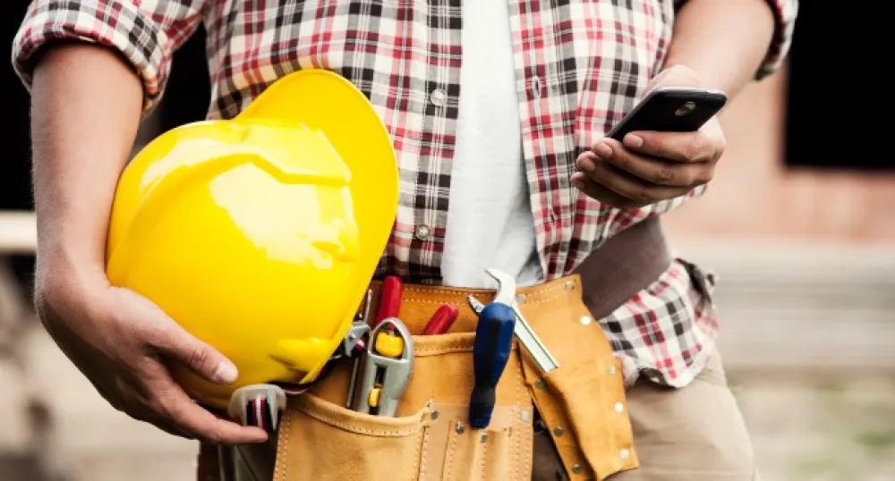 person holding a hard-hat