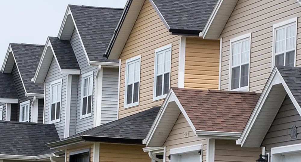 Home Insulation Rebates for windows, doors, insulation Exterior shot of row of homes