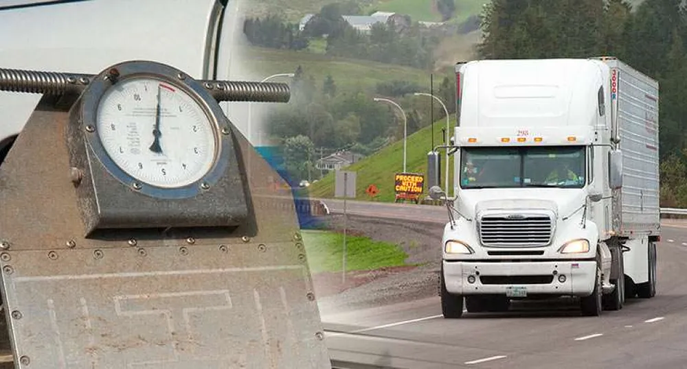 Image of scale on left side and transport trailer and truck on the right in Bonshaw, PEI