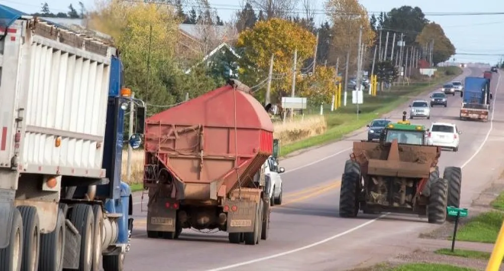Tractors and cars on a PEI highway