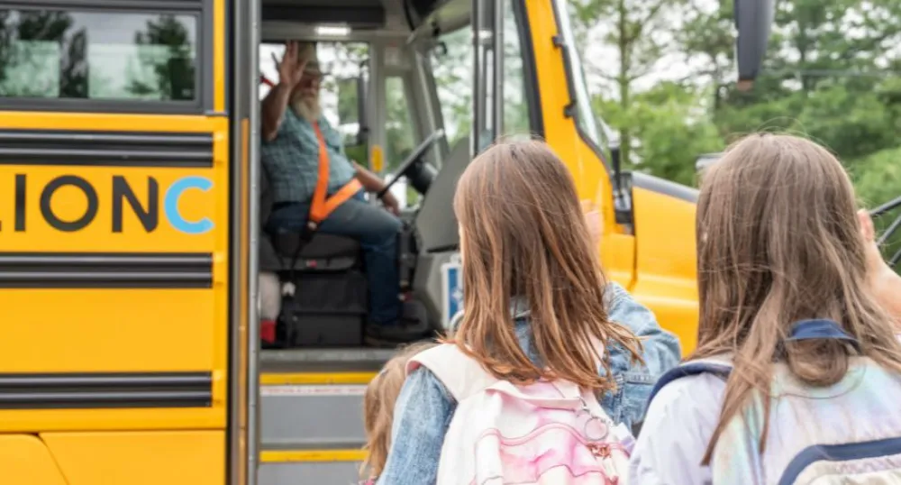 Statement by Premier King on the first day of the 2024/2025 School Year image of children getting on a school bus