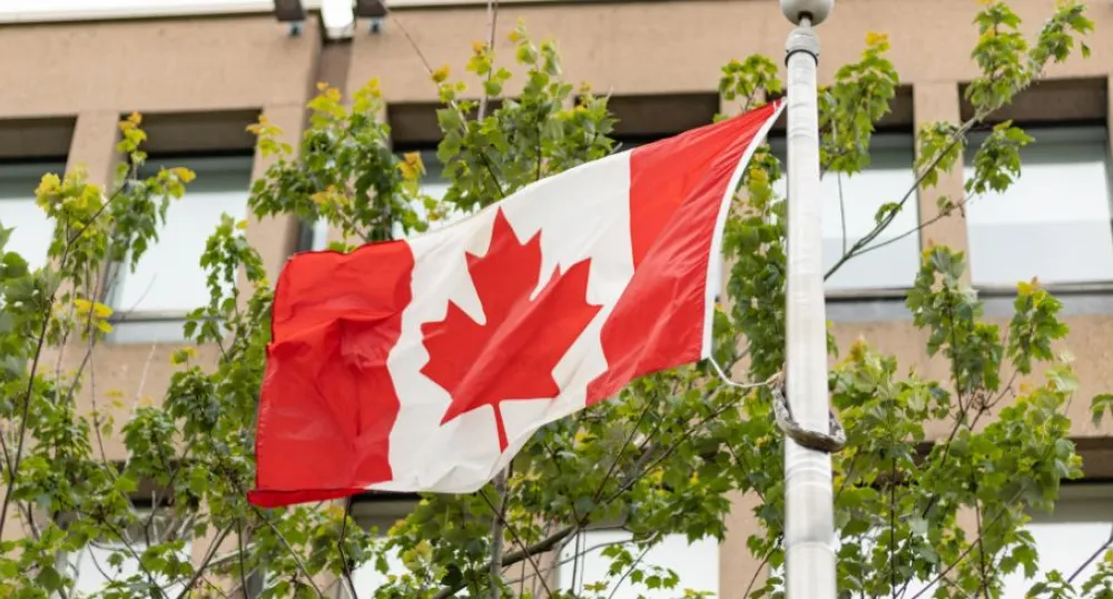 Statement by Premier King on Canada Day image of a flag in front of a building