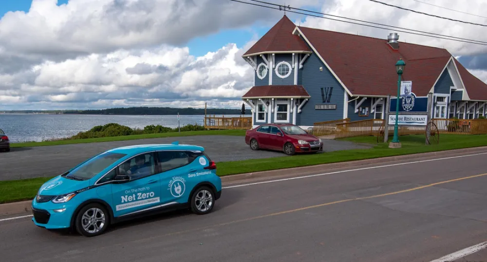 Province partners with Safe Drivers PEI so people can try out an electric vehicle image of an electric vehicle on a street with a building and a bay in the background