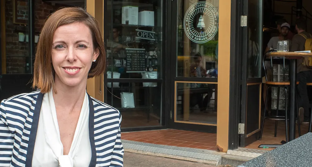 Island businesses have reasons to be confident Photo shows woman outside Receiver Coffee Company