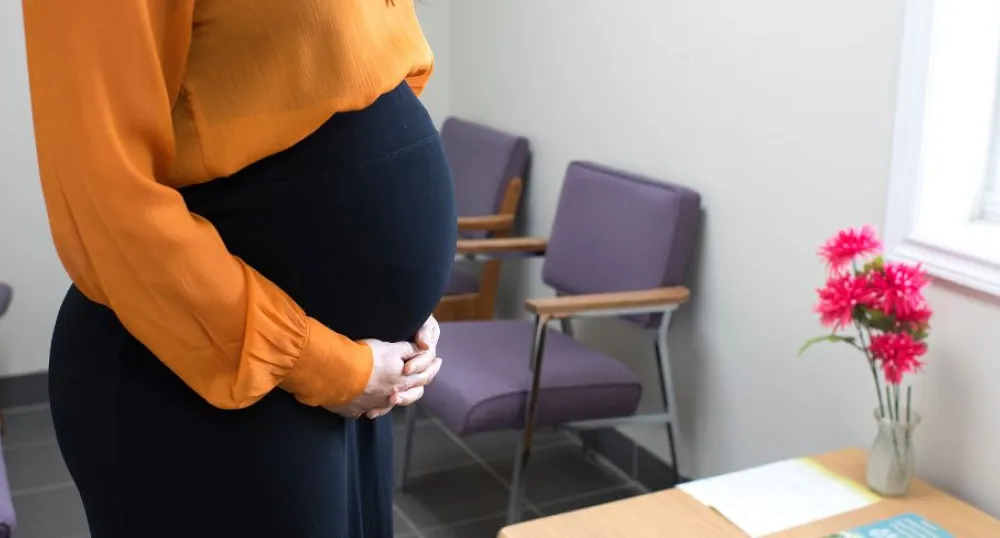 image of  a pregnant women in an office