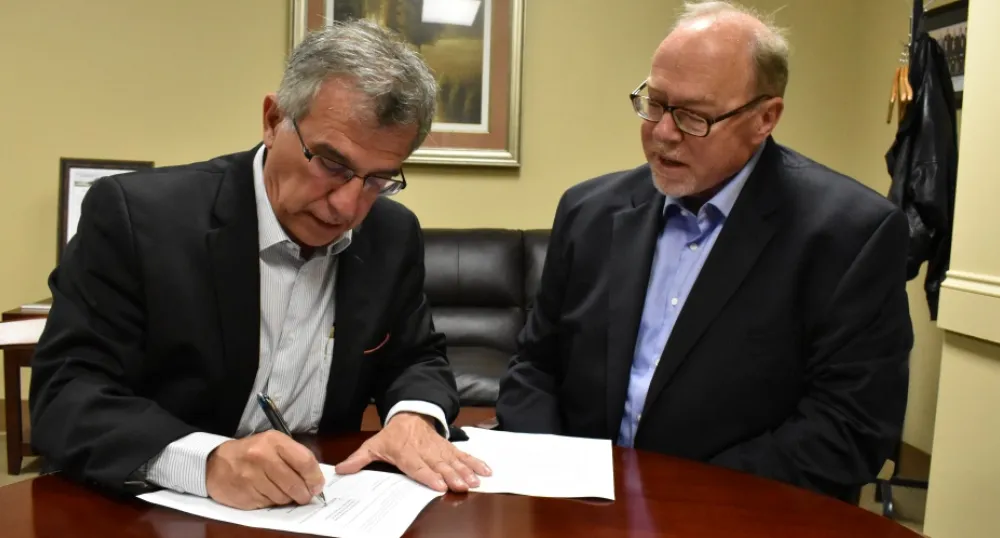 Minister Richard Brown and Maritime Electric CEO John Gaudet