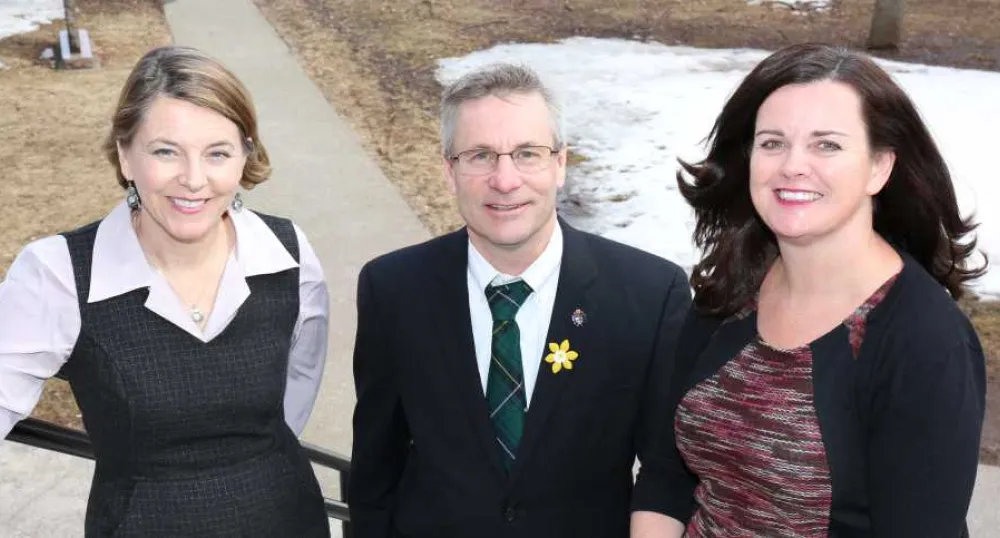 Patients will benefit from new nursing strategy Minster Henderson and two people standing in fronot of Coles Building