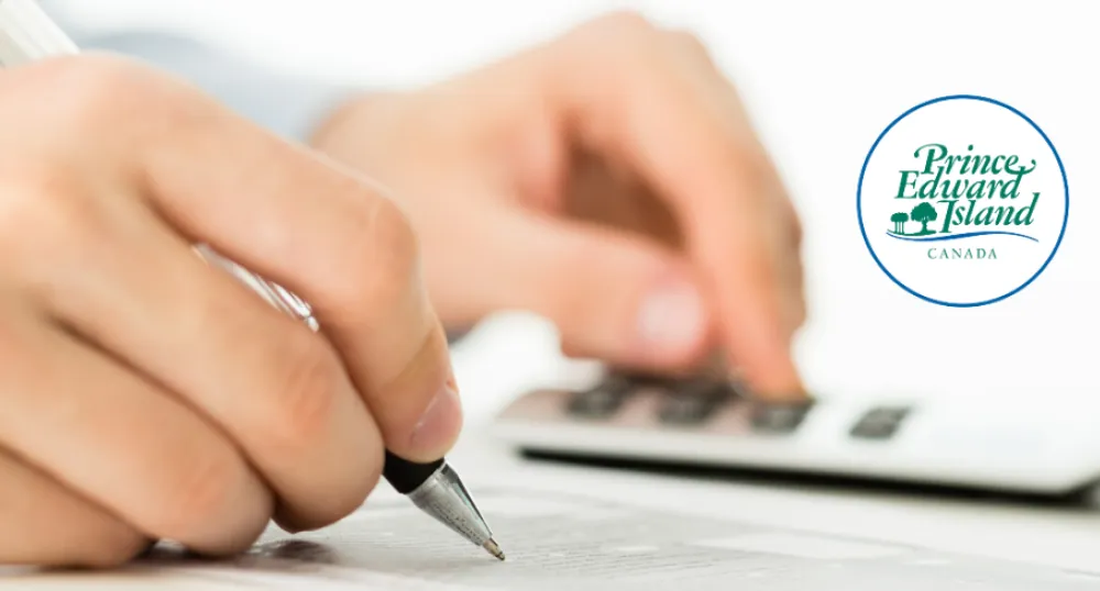 iStock image - copyright iStock image of person using calculator with PEI wordmark