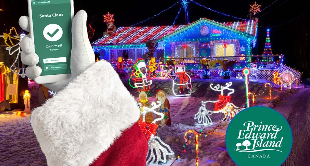 Premier King and Dr. Morrison brief Santa Claus on COVID-19 restrictions on PEI and verifies VaxPass image of Santa holding his cellphone with a confirmed VaxPass message on it