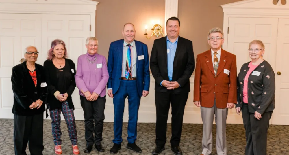 Seniors recognized for Outstanding Contributions to Island Communities image of 7 people standing shoulder to shoulder