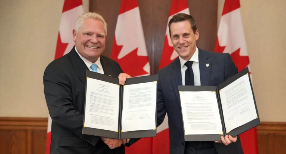 Premier Doug Ford and Premier Rob Lantz smile next to each other