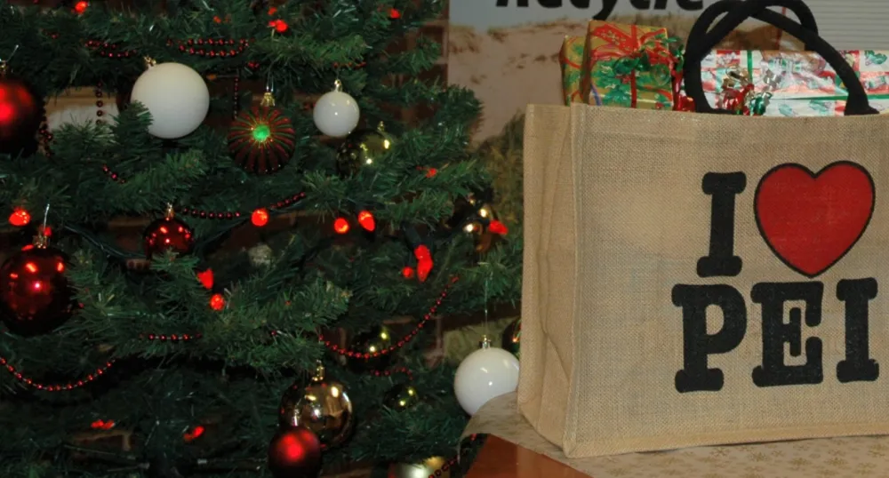Islanders show strong support for reducing single-use plastic bags to benefit the environment a Christmas tree beside with a shopping bag full of wrapped gifts