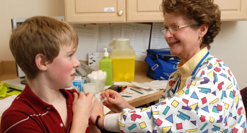 Image of a nurse immunizing a child