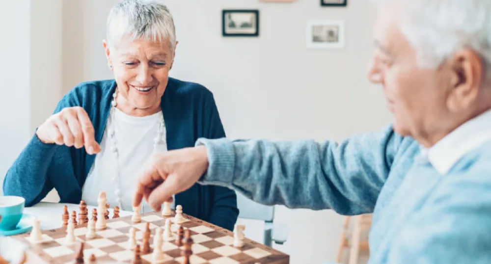 senior couple playing chess