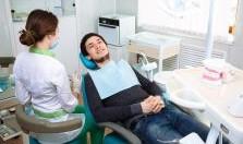 Dentist woman doing the procedure in the dental office