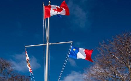 Image of PEI flag, Canada flag and Acadian flag at Government House