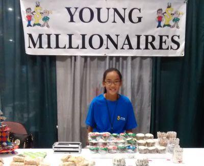 Olivia displayed her baked goods at a Young Millionaires event