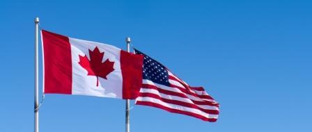 iStock image of Canada and USA flags outdoors