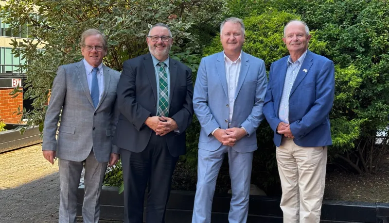 The four Atlantic Transportation Ministers stand next to each other outside.
