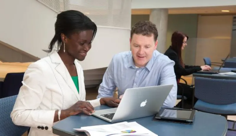 people looking at a computer