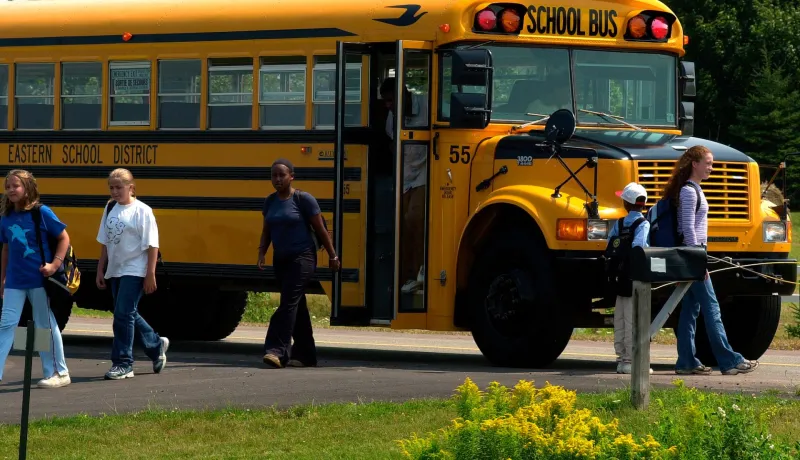 Children getting off a school bus