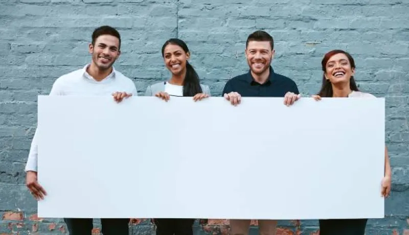 people holding a blank  sign