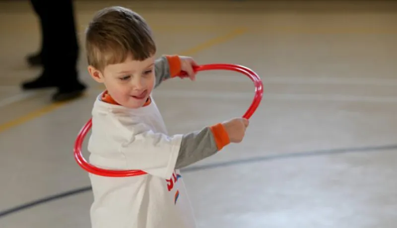 Boy playing with a hula hoop