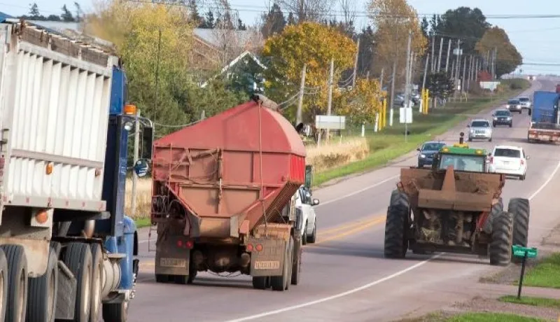 Tractors and cars on a PEI highway