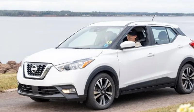 youth driving a car
