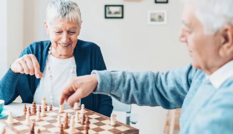 senior couple playing chess