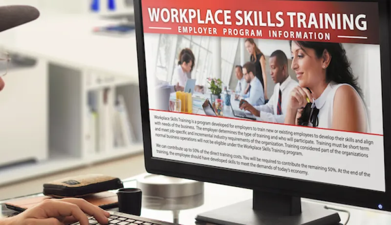 Man looking at Workplace Skills Training Info on Computer