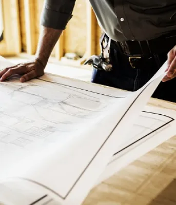 A contractor looking over building plans.
