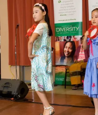 Young girls dance at a diversity festival 