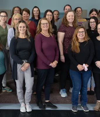The Health PEI home care team A large group photo of smiling men and women in casual clothing