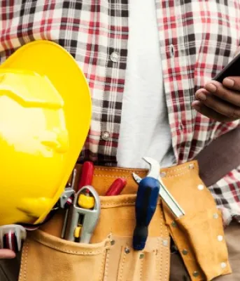 person holding a hard-hat