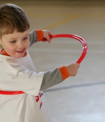 Boy playing with a hula hoop