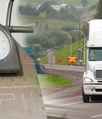 Seasonal weight restrictions Image of scale on left side and transport trailer and truck on the right in Bonshaw, PEI