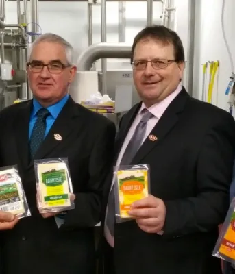 ADL adding new jobs, products in Summerside Photo shows four men holding packaged ADL cheese products