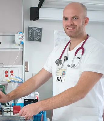Andrew Fudge, RN at work in a clinical setting