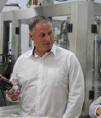 PEI Brewing Company to pursue new market opportunities Photo shows three men standing amid brewing equipment