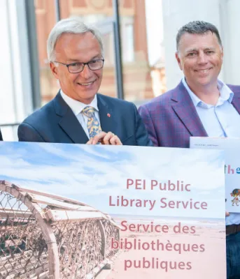 Charlottetown Library Learning Centre moving to bigger location Four people shoulder to shoulder
