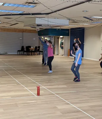 Woman instructing dance students