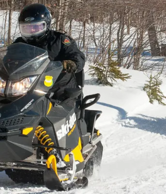 PEI’s Conservation Officers patrolling on snowmobiles. PEI’s Conservation Officers patrolling on snowmobiles.