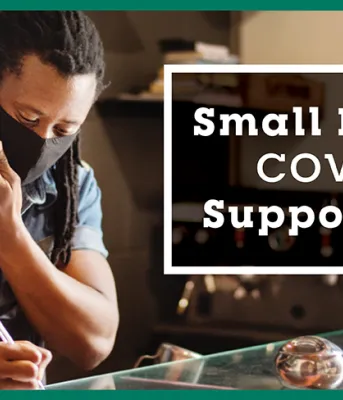 Province offers support grant for small businesses image of a person at a work counter taking an order over the phone.